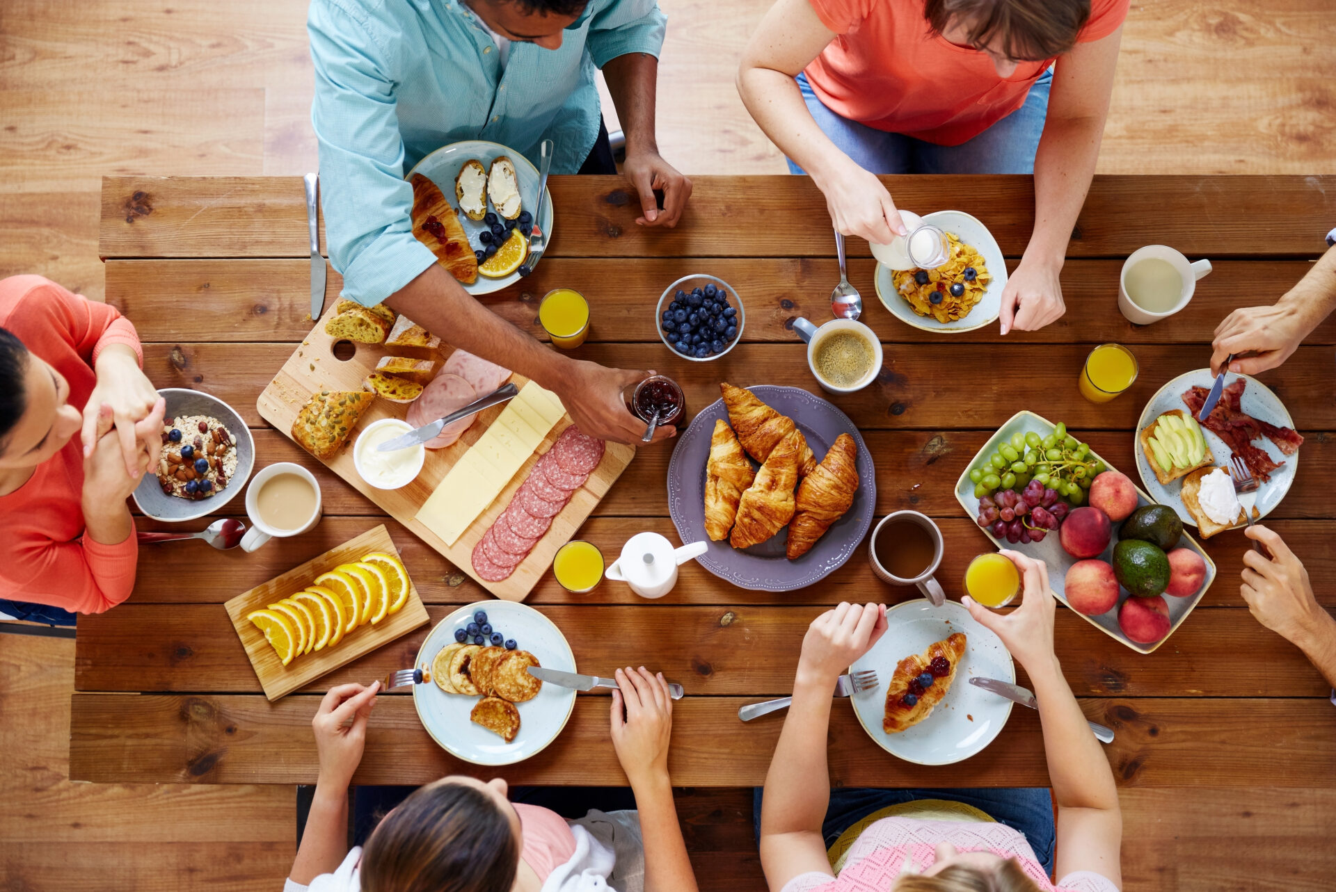 group of people having breakfast at table